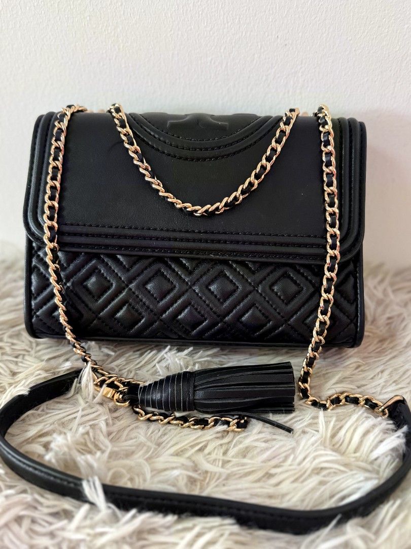Tory Burch Black Quilted Leather Chain Shoulder Bag (Category: Luxury Bags & Wallets) located in Caloocan City. Submitted by mylove326 (Listing ID 1460801019, Image 1). Description: -Original Tory Burch Fleming -Black quilted leather shoulder bag - Signature Tory Burch logo - Gold chain strap - Tassel detail - Measurements: L 20cm x H 14cm x W 6cm - Versatile for day or night use -Can use as shoulder bag or body bag.. -Good as New -Used once or t