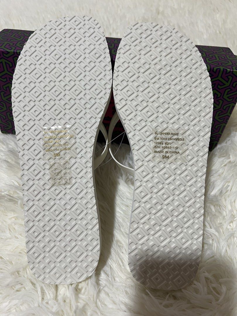 Tory Burch "Canning Emboss" Flip Flops - Size 9 (Category: Slippers and slides) located in Guagua. Submitted by boniscloset (Listing ID 1460738484, Image 3). Description: - Authentic White Tory Burch Flip Flops - Classic Embossed Tory Burch Pattern - Size: US 9 - Comes with Original Box - Ideal for Beach Days & Casual Outings.