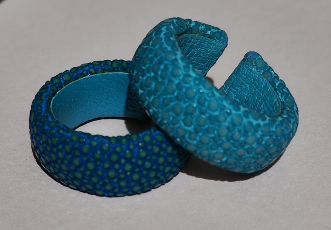 Turquoise Stingray Leather Band Rings (Category: Bracelets) located in Caloocan City. Submitted by mommyella22 (Listing ID 1460735159, Image 1). Description: - Two turquoise rings, Handmade - Unique stingray-like texture - Bright blue inner lining - Eye-catching accessory - Perfect for adding a pop of color - Smooth finish on the inside.