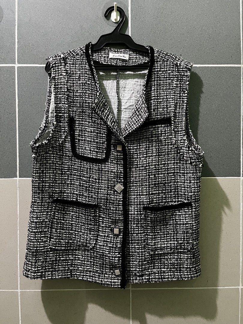 Tweed Vest with Pearl Buttons (Category: Sleeveless) located in Manila. Submitted by myth.rifts (Listing ID 1460840441, Image 1). Description: - Stylish black and white tweed vest - Elegant black trim detail - Beautiful pearl-embellished buttons - Two functional front pockets - Sleeveless design for easy layering - Versatile piece to elevate any outfit - Approximate measurements: 17 inches (length), 16 inches (chest).