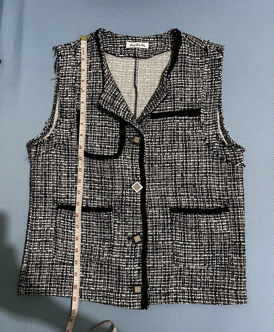 Tweed Vest with Pearl Buttons (Category: Sleeveless) located in Manila. Submitted by myth.rifts (Listing ID 1460840441, Image 3). Description: - Stylish black and white tweed vest - Elegant black trim detail - Beautiful pearl-embellished buttons - Two functional front pockets - Sleeveless design for easy layering - Versatile piece to elevate any outfit - Approximate measurements: 17 inches (length), 16 inches (chest).