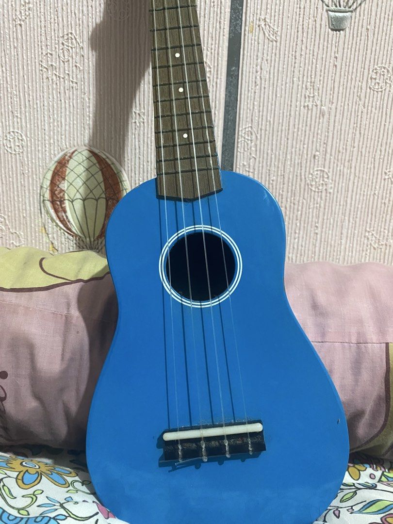 UKULELE (RJ Guitars) (Category: Musical Instruments) located in Manila. Submitted by chimkenren (Listing ID 1460812424, Image 2). Description: minimal issue :) didn’t use it that much, only for my 1 ukulele class. price is still negotiable srp is around 3k. - Bright blue ukulele - 4 strings - Wooden fretboard - Black tuning pegs on headstock - Ideal for beginners - Fun and easy to carry - Ready for a new home.