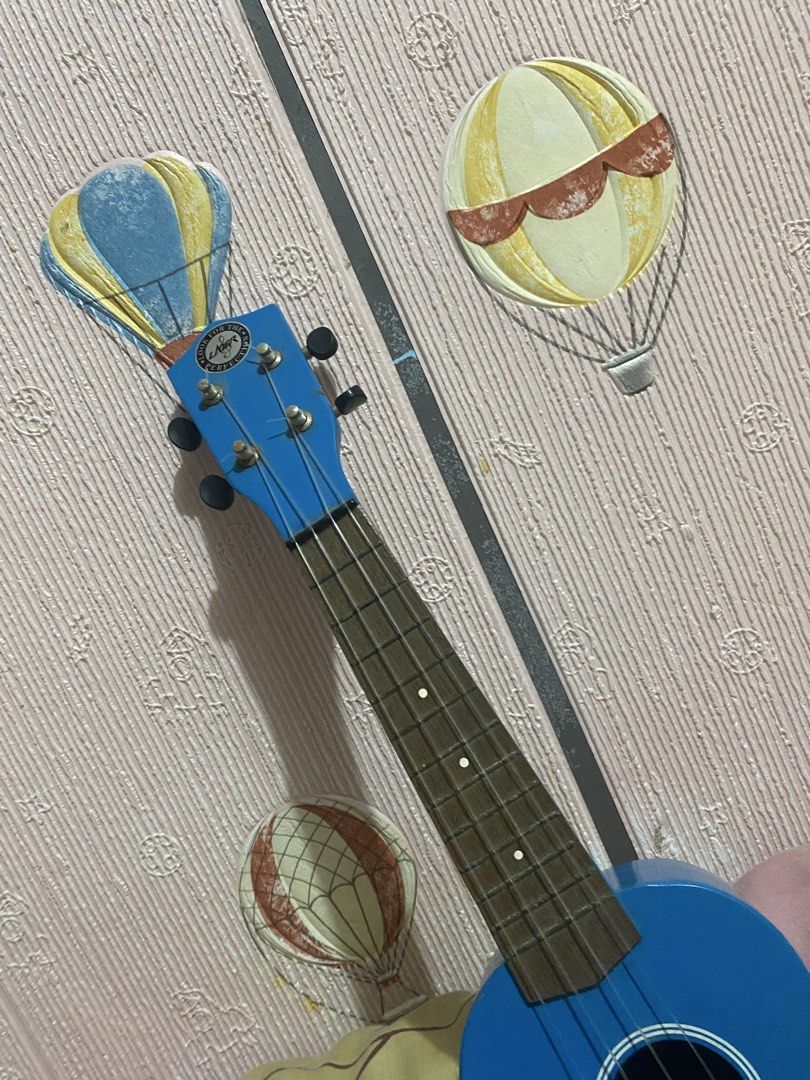 UKULELE (RJ Guitars) (Category: Musical Instruments) located in Manila. Submitted by chimkenren (Listing ID 1460812424, Image 3). Description: minimal issue :) didn’t use it that much, only for my 1 ukulele class. price is still negotiable srp is around 3k. - Bright blue ukulele - 4 strings - Wooden fretboard - Black tuning pegs on headstock - Ideal for beginners - Fun and easy to carry - Ready for a new home.