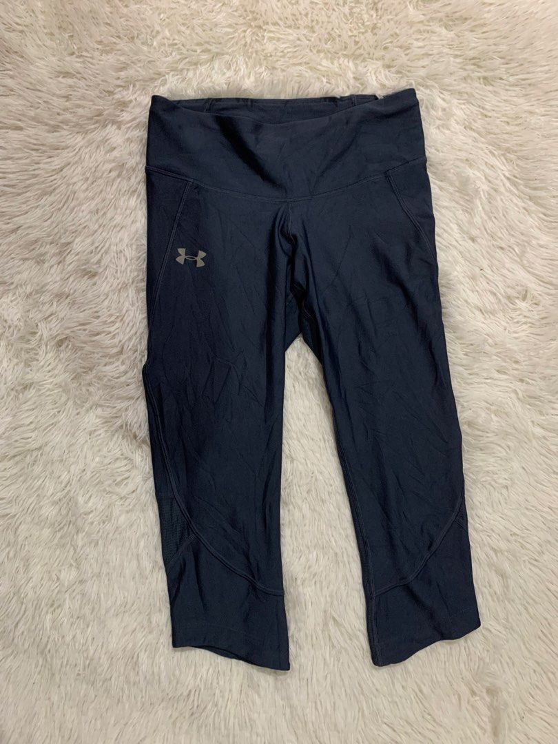 Under Armour HeatGear Compression Capris M/MD (Category: Activewear) located in Iba. Submitted by thriftcoyan (Listing ID 1460726187, Image 1). Description: - Under Armour HeatGear Capris - Size: M/MD - Color: Dark Navy Blue - Fit: Compression - Ideal for: Workouts, running, training - Features: Zippered back waistband pocket, mesh paneling on lower leg - Origin: Made in Jordan.
