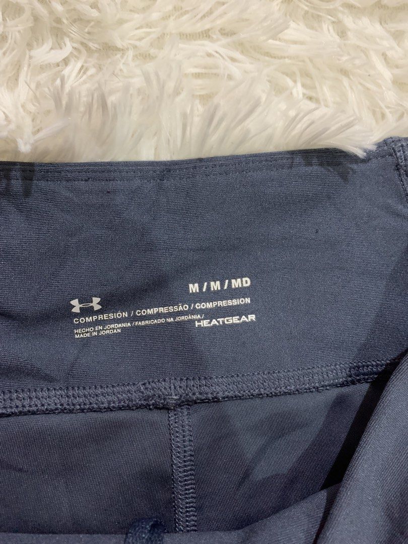 Under Armour HeatGear Compression Capris M/MD (Category: Activewear) located in Iba. Submitted by thriftcoyan (Listing ID 1460726187, Image 3). Description: - Under Armour HeatGear Capris - Size: M/MD - Color: Dark Navy Blue - Fit: Compression - Ideal for: Workouts, running, training - Features: Zippered back waistband pocket, mesh paneling on lower leg - Origin: Made in Jordan.
