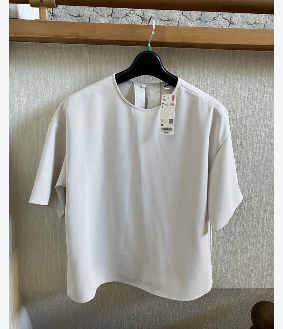 Uniqlo Draped Blouse (Category: Blouses) located in Marikina City. Submitted by nicasandoval (Listing ID 1460917977, Image 3). Description: used twice only.