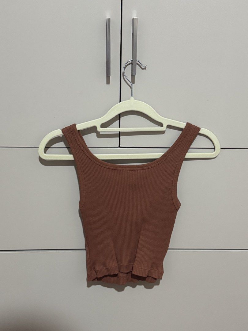 Uniqlo Ribbed Button Tank Top Brown Size S (Category: Sleeveless) located in Antipolo. Submitted by nyeahsells (Listing ID 1460786570, Image 2). Description: Pre-loved Size: S Color: Brown Flaw: None RFS: decluttering Swipe photos to see more details about the item. Disclaimer: - All sales final (NO RETURN, NO EXCHANGE) - Our shop will not be liable for any damages due to mishandling by the courier - Please manage expectations - First to pay gets