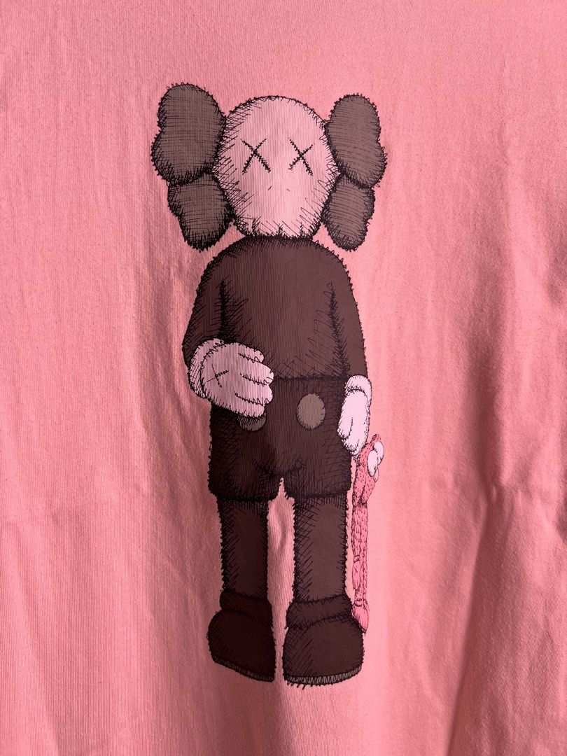 UNIQLO X KAWS PINK CW (Category: Activewear) located in Balamban. Submitted by jersey033 (Listing ID 1460830190, Image 2). Description: 27.5/20 dimes In great condi No issue .