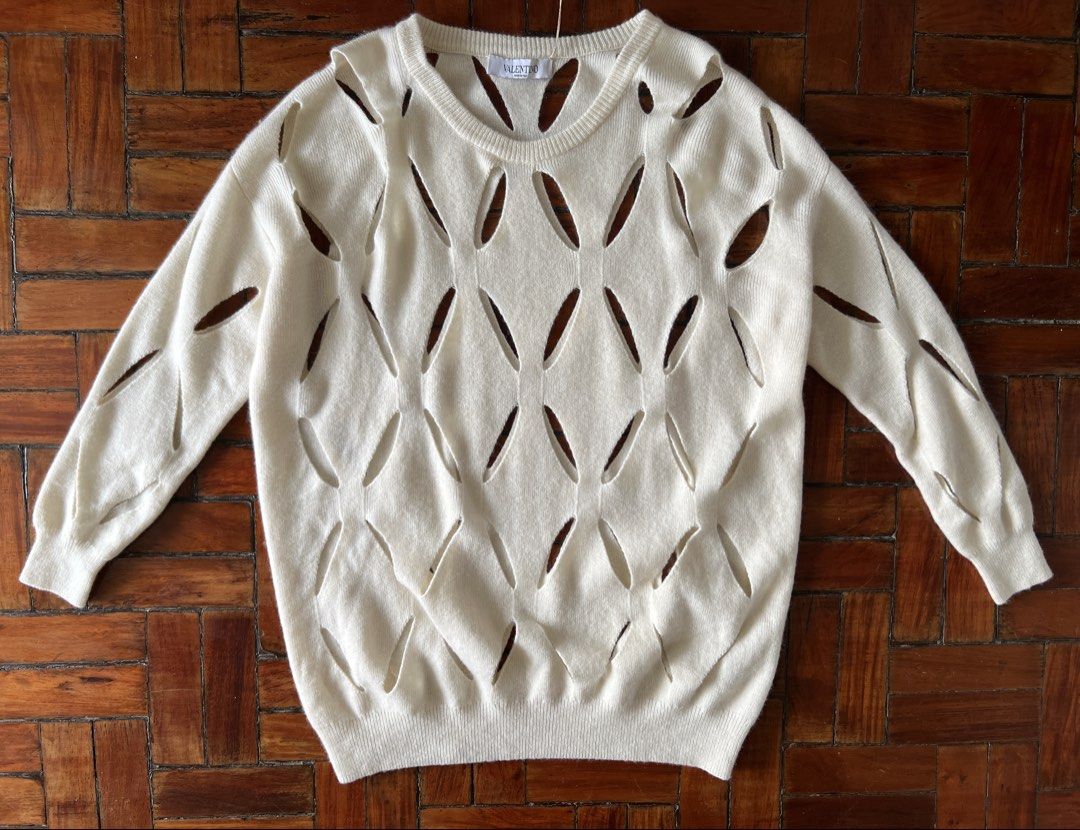 Valentino Fall 2011 slash sweater (Category: Luxury Apparel) located in Quezon City. Submitted by raccoonfur (Listing ID 1460754624, Image 3). Description: Valentino Fall 2021 slash cashmere-wool sweater. In off white. Great condition. Has inner marking, dry clean should sort it out easily. Interesting fall when worn. Flat measurements: Pit to pit 57cm/22.25in Length 70.25cm/27.6in Sleeve inseam 37cm/14.5in Shoulders 55cm/21.5in.