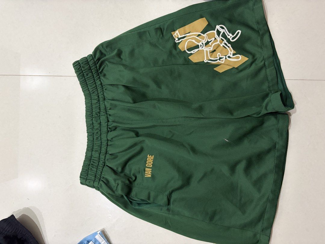 Vangore mesh shorts (Category: Shorts) located in Marilao. Submitted by astroman.22 (Listing ID 1460887581, Image 2). Description: - Green mesh shorts - Features a cool graphic print on the front - Elastic waistband for a comfortable fit - Ideal for basketball or casual wear - Ready for a new owner.