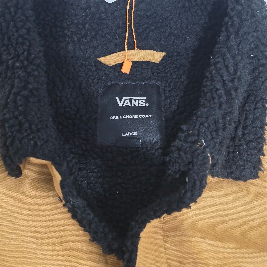 Vans Sherpa Lined Workwear Jacket Tan (Category: Coats, Jackets and Outerwear) located in Manila. Submitted by nnthrift_ (Listing ID 1454678789, Image 2). Description: - Tan Vans workwear jacket - Sherpa lined collar and interior for warmth - Button-up front with convenient chest pockets - Iconic Vans logo patch on the right chest - Ideal for staying cozy in cooler weather.