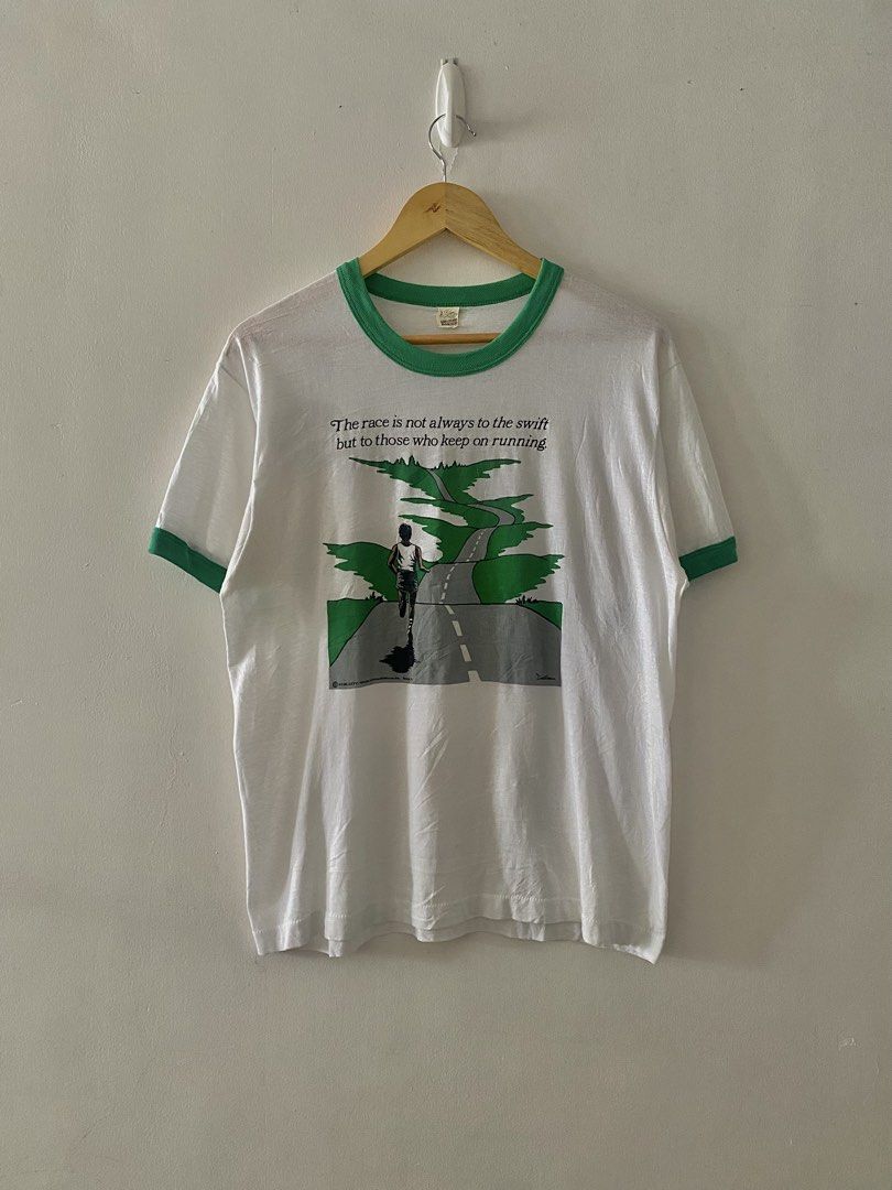 Vintage 1986 Race Green Statement Ringer Tee (Category: Tshirts & Polo Shirts ) located in Quezon City. Submitted by rlphvncntbs (Listing ID 1460754937, Image 1). Description: Vintage 1986 "The Race is not always to the swift but to those who keeps on running" Green Statement Ringer Tee Size: Large Measurements: 21" x 26" Flaws: Pinholes, Light Yellowing Stains Still in Good Condition Screen Stars Tag ₱2,000 + SF (Negotiable).