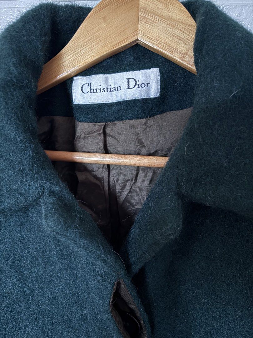 Christian Dior Forest Green Coat (Category: Coats, Jackets and Outerwear) located in Batangas. Submitted by purple_and_orange (Listing ID 1460780362, Image 3). Description: - Classic Christian Dior long coat - Deep green color - Wool blend material - Fully lined with satin-like fabric - Two front pockets - Button closure - Size 12 - A timeless addition to any wardrobe.