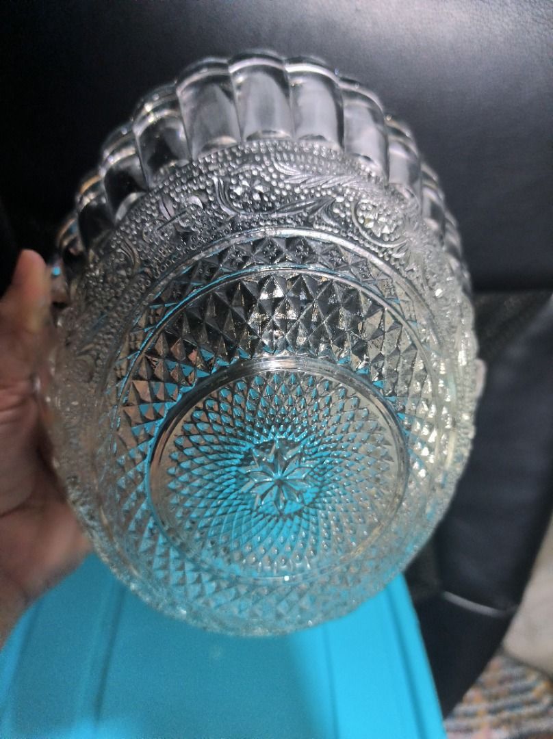 Vintage Clear Glass Fruit Basket with Handle (Category: Vases & Decorative Bowls) located in Manila. Submitted by leivon (Listing ID 1460842996, Image 2). Description: - Clear glass basket with a convenient handle. - Features a beautiful fluted rim. - Intricate embossed patterns adorn the base and sides. - Ideal for serving fruits or as a stylish decorative accent. - Approximate dimensions: X inches long, Y inches wide, and Z inches tall (includi