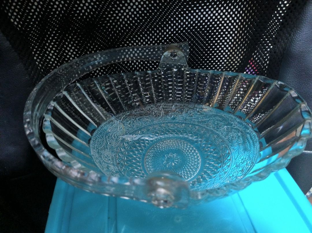 Vintage Clear Glass Fruit Basket with Handle (Category: Vases & Decorative Bowls) located in Manila. Submitted by leivon (Listing ID 1460842996, Image 3). Description: - Clear glass basket with a convenient handle. - Features a beautiful fluted rim. - Intricate embossed patterns adorn the base and sides. - Ideal for serving fruits or as a stylish decorative accent. - Approximate dimensions: X inches long, Y inches wide, and Z inches tall (includi