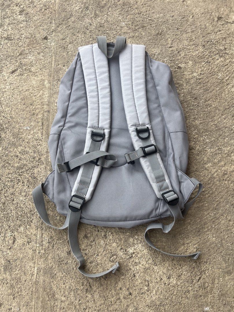 Vintage Nike Bag (Category: Backpacks) located in Manila. Submitted by thrifttolive (Listing ID 1460752806, Image 3). Description: - Grey Nike backpack with a vibrant orange accent. - Features adjustable straps for a comfortable fit. - Offers ample interior space, perfect for school or everyday essentials. - Shows some signs of wear, but remains fully functional..