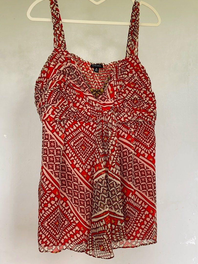 VINTAGE NINEWEST BOHO Y2K TOP (Category: Blouses) located in Naga. Submitted by willowjuls (Listing ID 1460745642, Image 1). Description: Super eye-catching vintage-style cami with an intricate red, cream & brown geometric print. ♡ Adjustable-looking spaghetti straps ♡ Ruched bust ♡ Draped neckline ♡ Beaded detail at neckline ♡ Lightweight fabric ♡ Flowy fit 🍥 size M-L 🍥 minor issues: some loose threads .