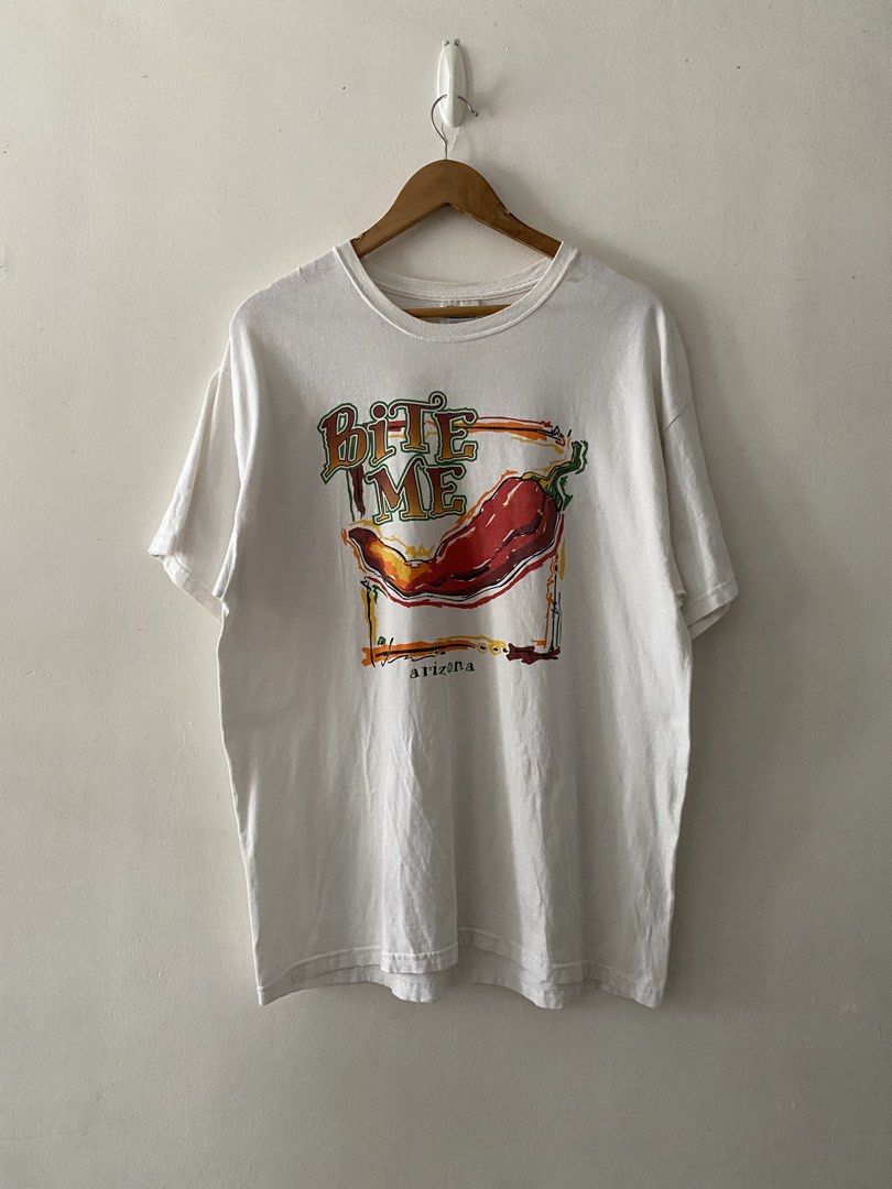 Vintage Y2K "Bite Me" Chili Pepper Graphic Tee (Category: Tshirts & Polo Shirts ) located in Quezon City. Submitted by rlphvncntbs (Listing ID 1460754232, Image 1). Description: Vintage Y2K "Bite Me" Chili Pepper Graphic Tee Size: Large Measurements: 22" x 29" Flaws: Light Stains (Removable) Still in Good Condition Hanes Comfort Tag ₱800 + SF (Negotiable).