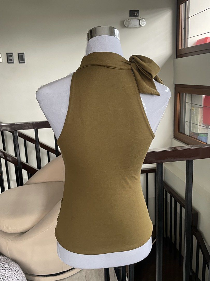 VXN Ruched Halter Neck Top Size S (Category: Blouses) located in Manila. Submitted by usedbylaila (Listing ID 1460896806, Image 2). Description: - Olive green halter neck top - Features ruching on the bodice - Tie detail at the neck - Sleeveless design - Proudly made in the Philippines - Perfect for dressing up or down - never been used only washed - rfs: color didn’t suit me .