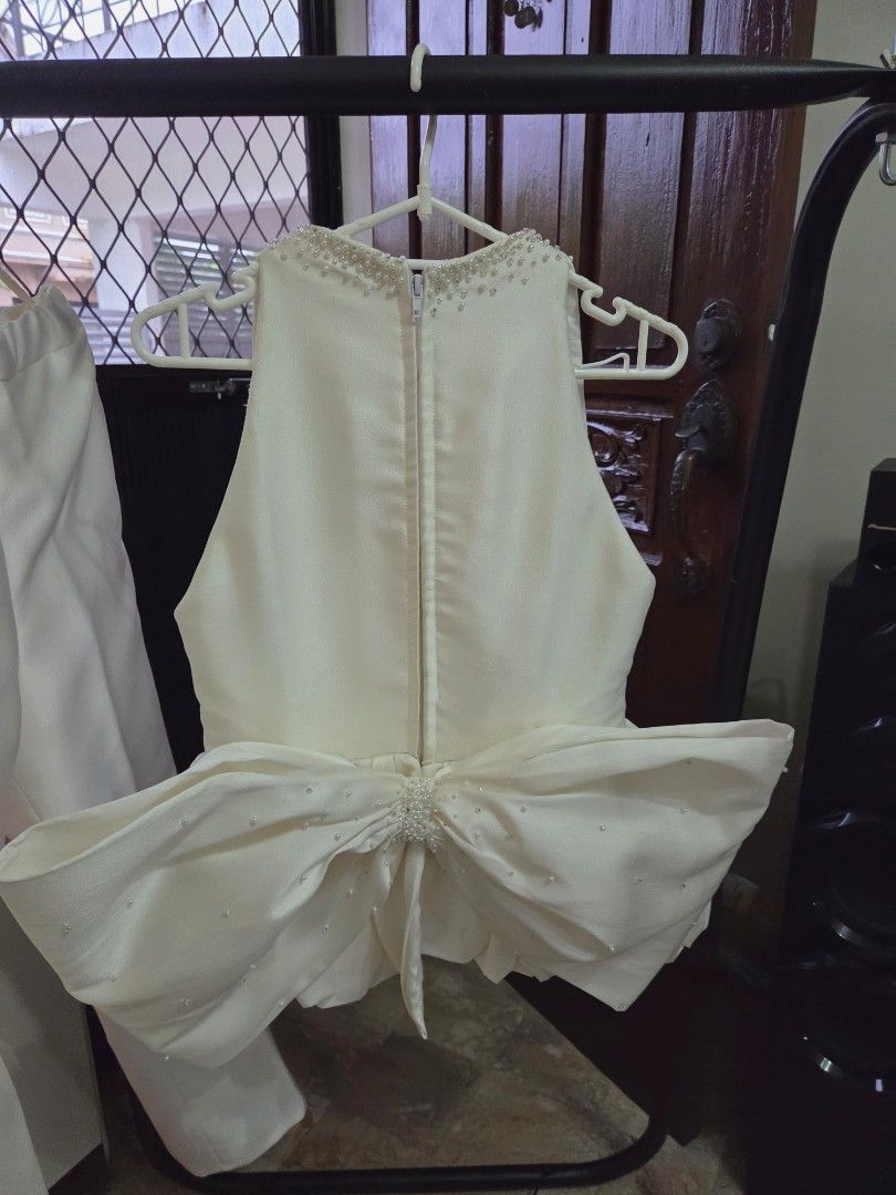 Wedding coords (Category: Sets or Coordinates) located in Cainta. Submitted by happy_shopping07 (Listing ID 1460813781, Image 3). Description: - Elegant white two-piece set perfect for wedding or formal occasions. - Sleeveless V-neck top featuring a beaded neckline and flattering peplum hem. - Convenient back zipper closure on the top. - Includes matching wide-leg pants for a complete, chic look. - Designed for a comfortable fit while maintaining
