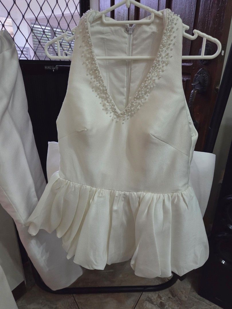 Wedding coords (Category: Sets or Coordinates) located in Cainta. Submitted by happy_shopping07 (Listing ID 1460813781, Image 1). Description: - Elegant white two-piece set perfect for wedding or formal occasions. - Sleeveless V-neck top featuring a beaded neckline and flattering peplum hem. - Convenient back zipper closure on the top. - Includes matching wide-leg pants for a complete, chic look. - Designed for a comfortable fit while maintaining
