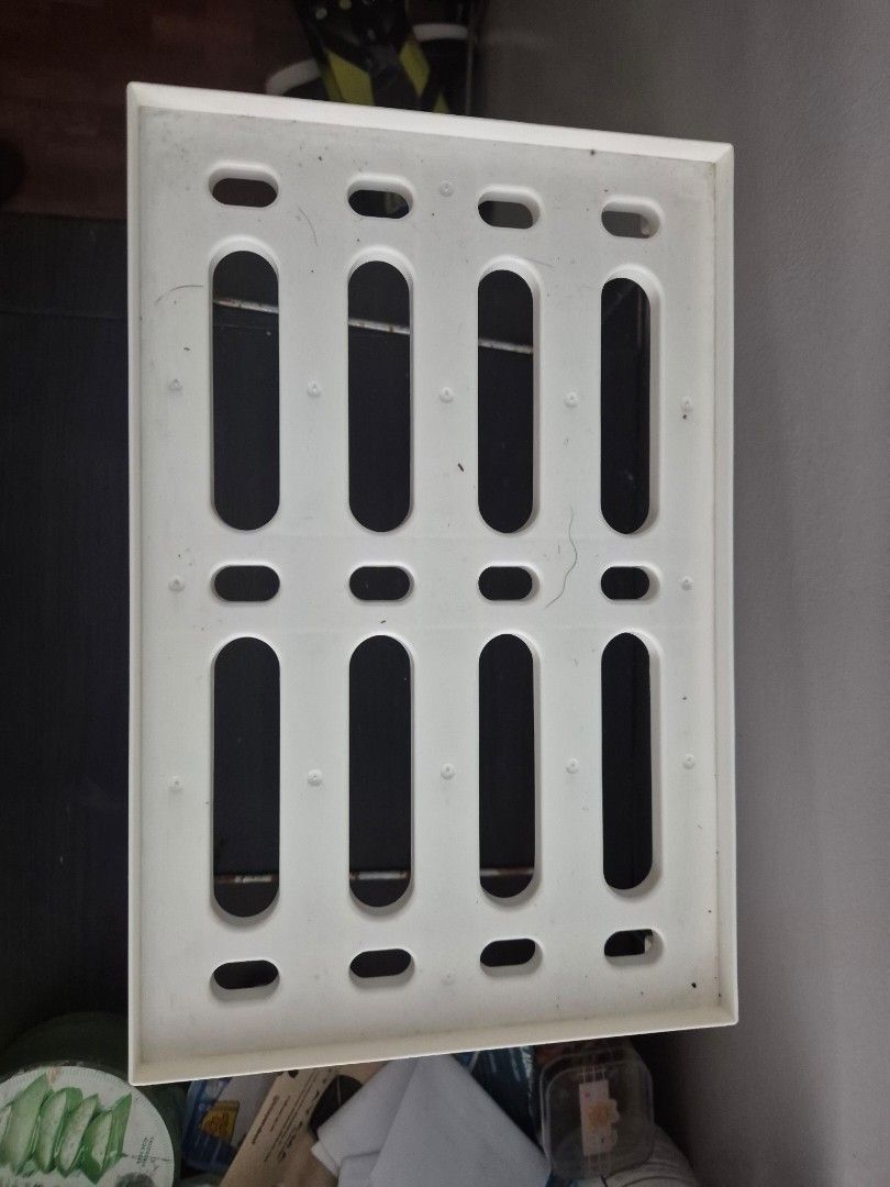 White Plastic Storage Shelf with Metal Rods (Category: Shelves, Cabinets & Racks) located in Manila. Submitted by zotag (Listing ID 1460717565, Image 2). Description: - White plastic shelf with sturdy metal support rods. - Features a slatted design for excellent ventilation. - Ideal for general storage and organizing needs. - Can also serve as a base for other items. - Shows minor signs of use, but remains fully functional..