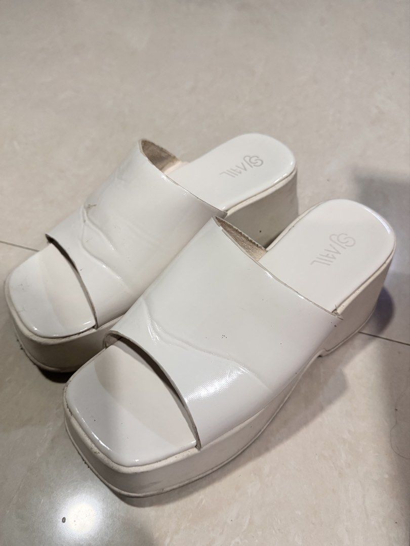 White Platform Mules Sandals (Category: Flats & Sandals) located in Taguig. Submitted by stuffsforlife101 (Listing ID 1460862677, Image 2). Description: - White platform mules - Open toe design - Chunky heel for added height - Easy slip-on style - Perfect for summer outfits - Comfortable for walking - Stylish and trendy.