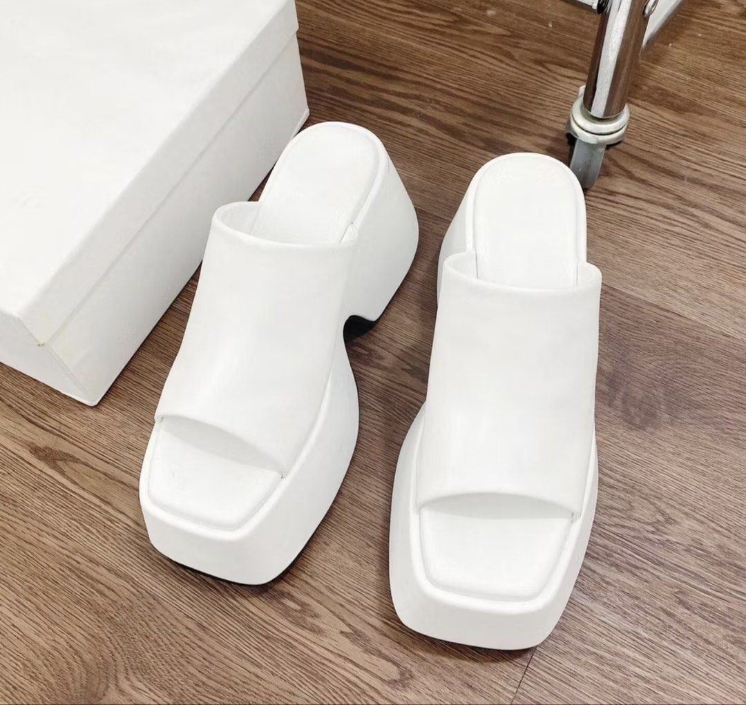 White Platform Mules Sandals (Category: Flats & Sandals) located in Taguig. Submitted by stuffsforlife101 (Listing ID 1460862677, Image 1). Description: - White platform mules - Open toe design - Chunky heel for added height - Easy slip-on style - Perfect for summer outfits - Comfortable for walking - Stylish and trendy.