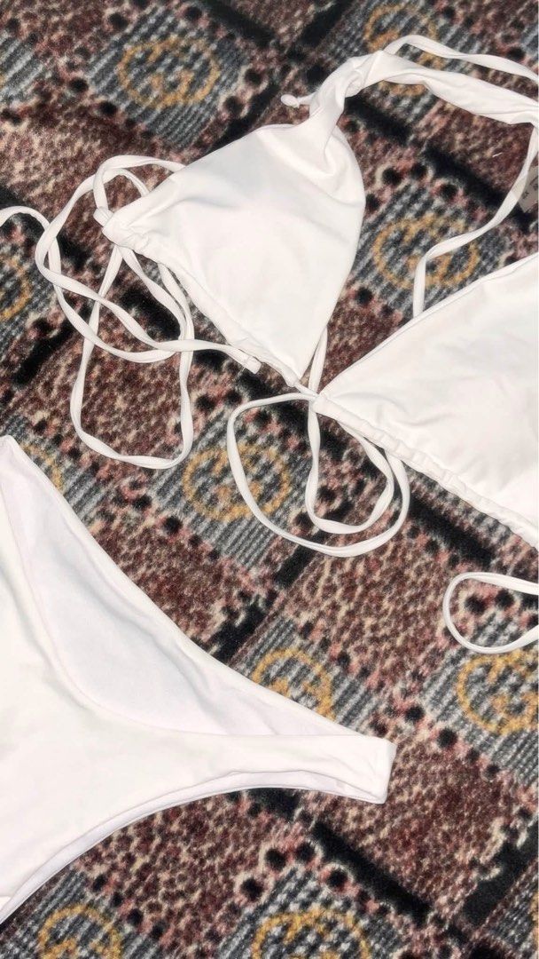 White String Bikini Set (Category: Bikinis & Swimsuits) located in Dagupan City. Submitted by shanadongsb (Listing ID 1460895383, Image 1). Description: - White bikini set - Triangle top with adjustable string ties - Matching bikini bottoms - Ideal for beach or pool - Comfortable and stylish - Perfect for your next vacation.