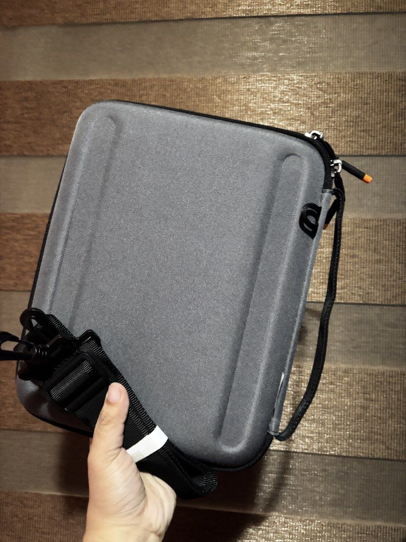 WIWU Grey Hard Shell Storage Case (Category: Storage Boxes & Baskets) located in Cebu City. Submitted by lloydhabas89820 (Listing ID 1460775852, Image 1). Description: - WIWU grey hard shell case - Ideal for storing electronics or accessories - Includes a convenient handle - Comes with a detachable shoulder strap - Secure zip closure - Clean and well-maintained interior - Ready for its new owner.