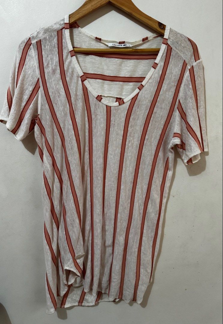 Women’s Lacoste Blouse (Category: Blouses) located in Quezon City. Submitted by vibelane_shop (Listing ID 1460850250, Image 1). Description: “This is a lightweight, semi-sheer top or shirt from Lacoste, featuring vertical stripes in white, pink, and orange tones. It is crafted from a breathable mesh knit or textured linen blend fabric, accented by the brand’s iconic embroidered crocodile logo matching the stripe color profile.If you are looking t