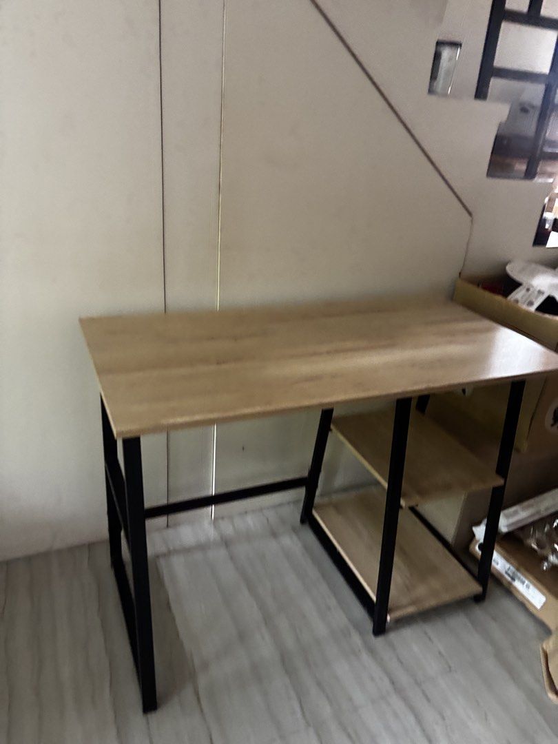 Wooden Study Desk with Shelves (Category: Tables & Sets) located in Manila. Submitted by cobyalmuete (Listing ID 1460771946, Image 2). Description: - Sleek study desk with a natural wooden top - Sturdy black metal frame for durability - Two convenient shelves on one side for storage - Ideal for home offices, study areas, or student rooms - Approximate dimensions: 120cm (L) x 60cm (W) x 75cm (H) RFS: Redesigning Of Room.