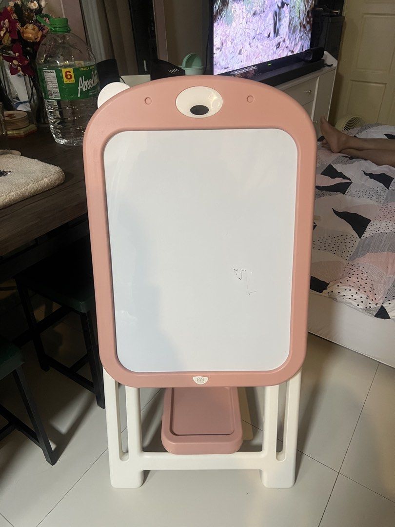 Writing Board/ Whiteboard (Category: Stationery & School Supplies) located in Cainta. Submitted by hunchester (Listing ID 1460889495, Image 1). Description: Whiteboard frame designed in the shape of a cute bear head. It features a sliding adjustable stand to match a child’s height and a matching pink plastic storage shelf at the bottom. The frame can also be completely folded flat for easy and compact storage. Issue: -Other ear design is missing 