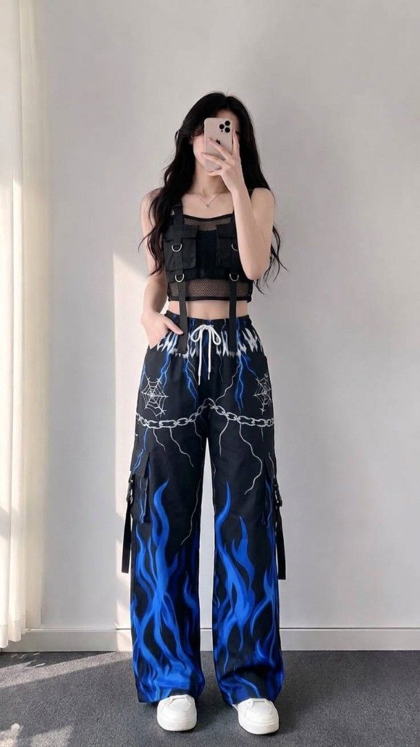 Y2K Flame & Spider Web Cargo Pants (Category: Jeans) located in Manila. Submitted by jenivaclai81140 (Listing ID 1460773703, Image 1). Description: - Super cool Y2K style cargo pants - Black with edgy flame and spider web print - Wide leg fit with adjustable drawstring waist - Multiple pockets and straps for an enhanced look - Available in blue or pink flame designs - Ideal for parties or casual wear.