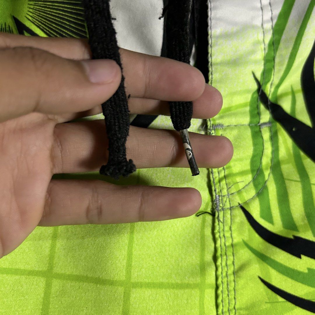 Y2k Quiksilver - Green Boardshort (Category: Swim Trunks & Board Shorts) located in Tayabas. Submitted by streetdepartment (Listing ID 1460901373, Image 3). Description: Y2k Quiksilver - Green Boardshort Measurements (inches): Waist: 32” Length: 22” Leg opening: 11” Tagged as 32 Excellent condition Flaw/s: Loose stitching on velcro.