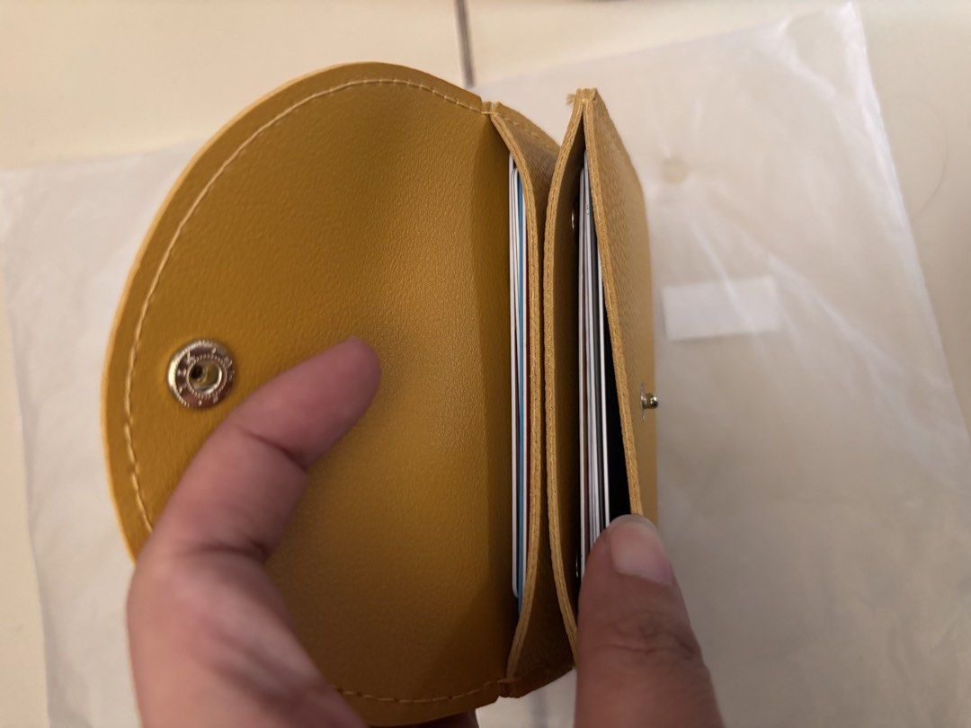 Yellow Singapore Card Holder (Category: Wallets & Card holders) located in Pasig City. Submitted by bookishnook (Listing ID 1460772146, Image 2). Description: - Cute yellow card holder - 'SINGAPORE' printed in gold - Secure snap button closure - Ample space for multiple cards - Small and compact design - Ideal for keeping essential cards organized.