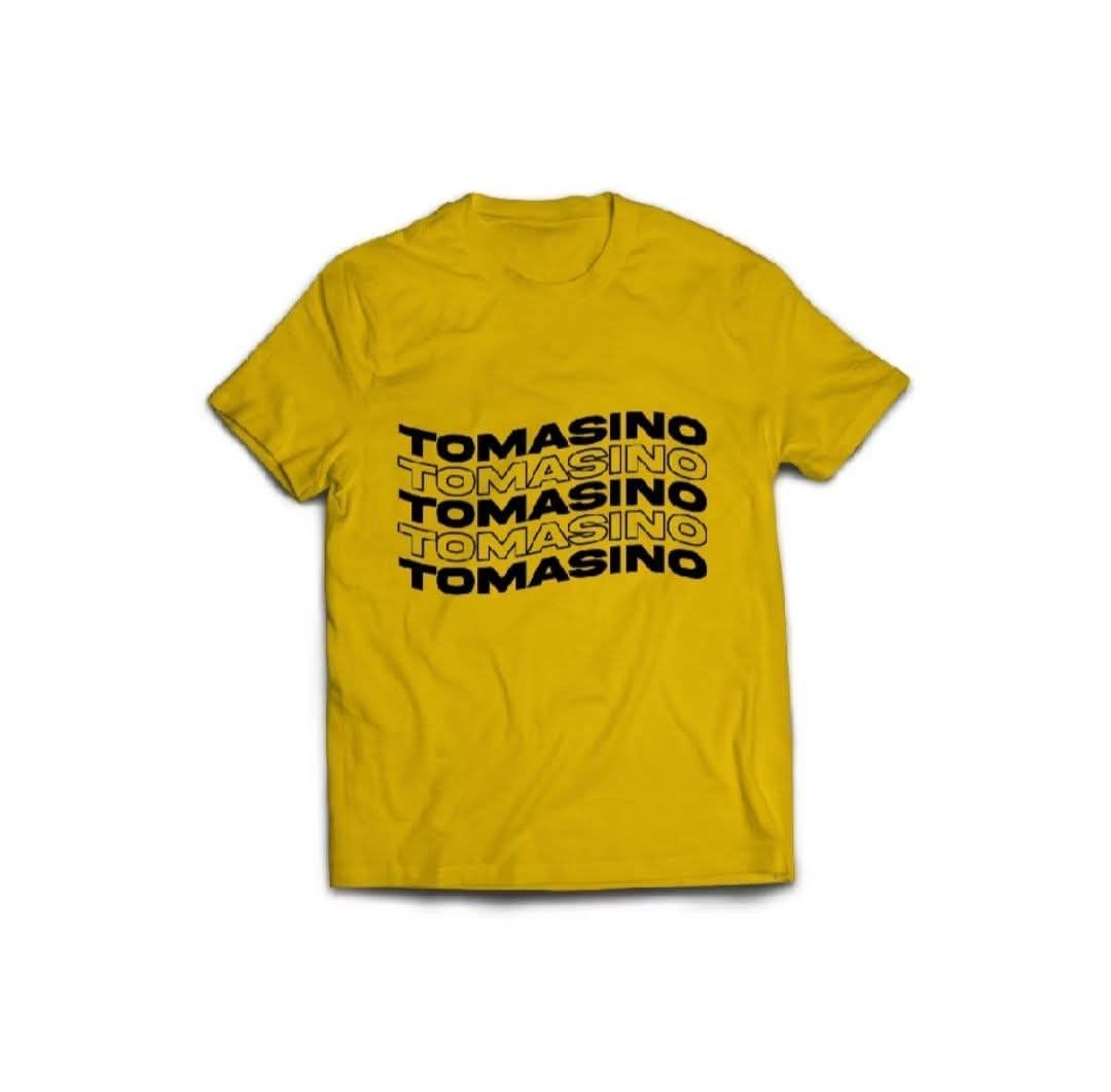 Yellow Tomasino T-shirt (Category: Shirts) located in Manila. Submitted by rkivene (Listing ID 1460910594, Image 1). Description: - Yellow t-shirt with black Tomasino graphic print - Simple crew neck, short sleeves - Perfect for casual wear - Size: Teens—Width: 17", Length: 24".