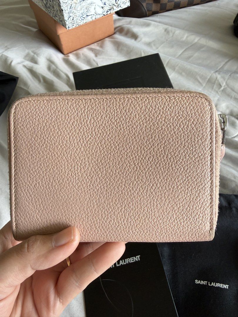 YSL Compact Wallet in Nude Pink (Category: Luxury Accessories) located in Calamba. Submitted by mom2girls (Listing ID 1460769602, Image 2). Description: Very neutral in color. Subdued in style. For those who do not like screaming brand print/logos, this is perfect for you kasi yung YSL logo niya nasa side zipper lang ng coin pocket. Shipping via LBC only. SF c/o Buyer..
