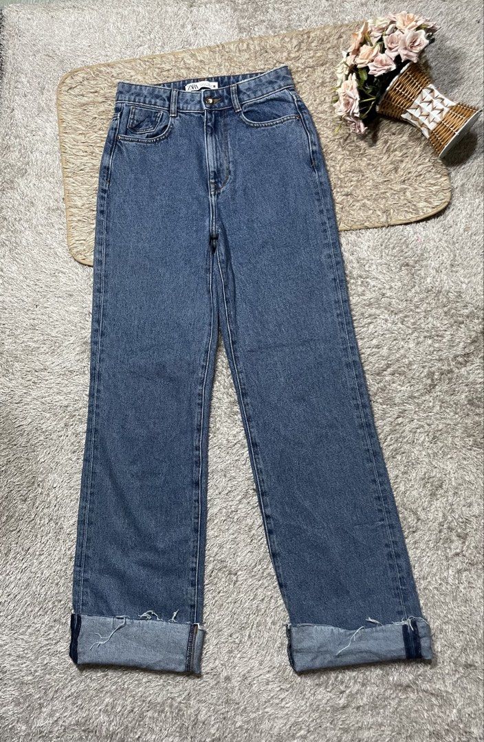 ZARA Blue Denim Jeans (Category: Jeans) located in Manila. Submitted by rutchemari68583 (Listing ID 1460773447, Image 1). Description: - ZARA Blue Denim Jeans - High-waisted fit - Straight leg cut - Cuffed hems with distressed detail - Ideal for everyday casual wear - Versatile: pairs easily with any top Waistline 26-27 Length 43.