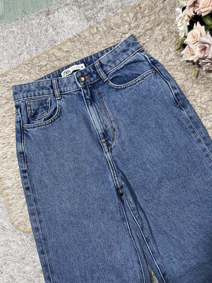 ZARA Blue Denim Jeans (Category: Jeans) located in Manila. Submitted by rutchemari68583 (Listing ID 1460773447, Image 2). Description: - ZARA Blue Denim Jeans - High-waisted fit - Straight leg cut - Cuffed hems with distressed detail - Ideal for everyday casual wear - Versatile: pairs easily with any top Waistline 26-27 Length 43.