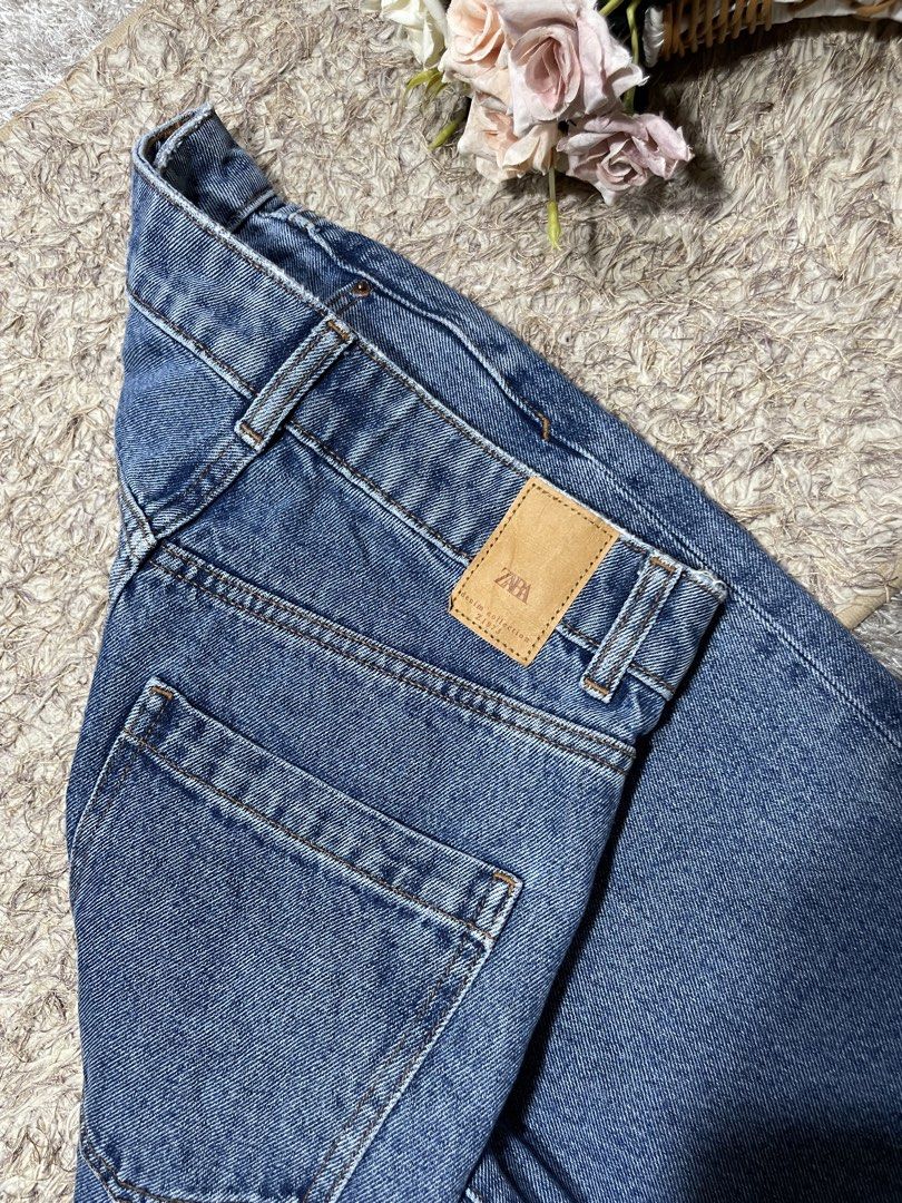 ZARA Blue Denim Jeans (Category: Jeans) located in Manila. Submitted by rutchemari68583 (Listing ID 1460773447, Image 3). Description: - ZARA Blue Denim Jeans - High-waisted fit - Straight leg cut - Cuffed hems with distressed detail - Ideal for everyday casual wear - Versatile: pairs easily with any top Waistline 26-27 Length 43.