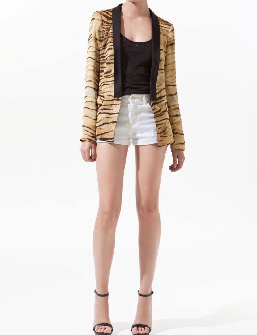 Zara Tiger Print Blazer with Black Lapels (Category: Coats, Jackets and Outerwear) located in Mandaluyong City. Submitted by hopeworldplane (Listing ID 1460842485, Image 1). Description: - Eye-catching tiger print blazer - Features sleek black satin lapels - Versatile: pairs well with shorts or jeans - Ideal for a night out or as a statement piece - Long sleeves - Classic button front closure.