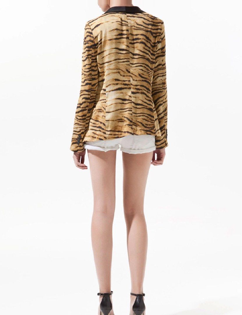 Zara Tiger Print Blazer with Black Lapels (Category: Coats, Jackets and Outerwear) located in Mandaluyong City. Submitted by hopeworldplane (Listing ID 1460842485, Image 2). Description: - Eye-catching tiger print blazer - Features sleek black satin lapels - Versatile: pairs well with shorts or jeans - Ideal for a night out or as a statement piece - Long sleeves - Classic button front closure.