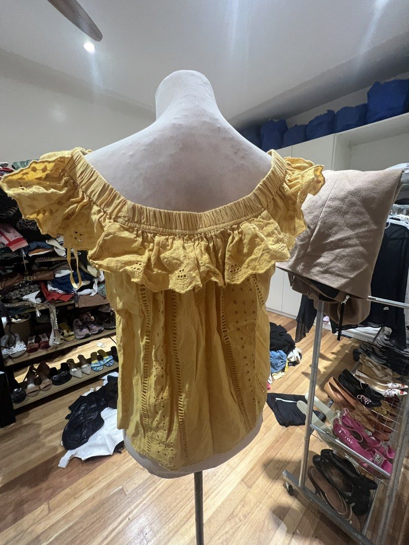 Zara TRF Yellow Eyelet Off-Shoulder Top (Category: Blouses) located in Quezon City. Submitted by iminquezoncity (Listing ID 1460809525, Image 3). Description: - Zara TRF yellow off-shoulder top - Eyelet details and tie-front neckline - Ruffled trim along neckline and sleeves - Lightweight and airy fabric - Ideal for warm weather - Versatile styling with shorts or jeans.
