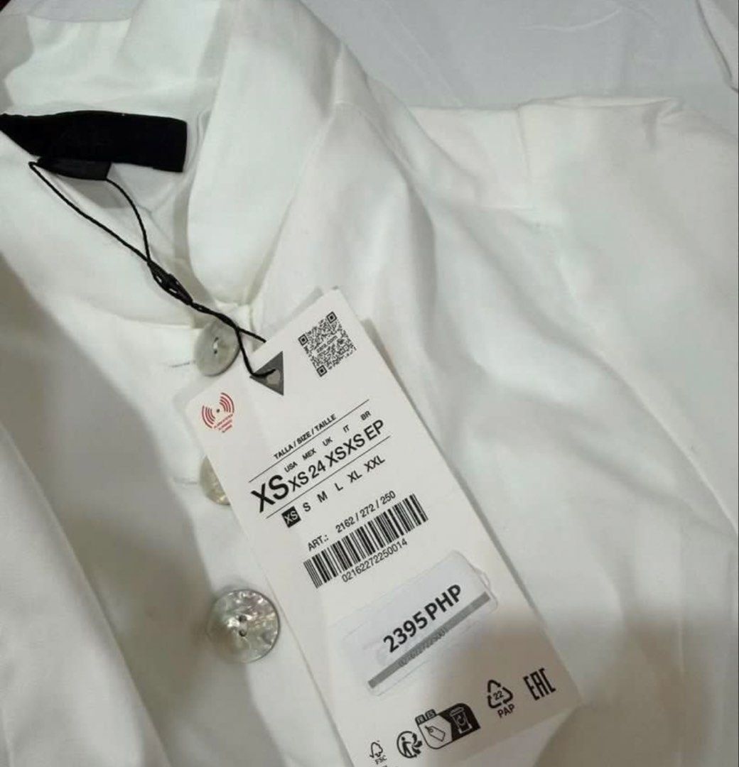 Zara White Buttoned Up Puff Sleeve Top (Category: Blouses) located in Taguig. Submitted by her.thrift (Listing ID 1460868983, Image 3). Description: 🫐 fixed/last price lowballers will be blocked 🫐 removed tag to fit but it’s tight on my waist 🫐 pasabuy from my sister so i wasn’t able to fit 🫐 original zara, for petite girls 🫐 classy, perf for work 🫐 NO WW .