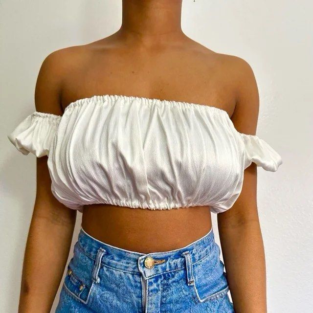 Zara White Off-Shoulder Smocked Crop Top (Category: Others Tops) located in Taguig. Submitted by lovedby_flora (Listing ID 1460754698, Image 1). Description: ❤️LAST PRICE POSTED - Cute white off-shoulder crop top - Smocked bust for a flattering fit - Ruffled sleeves add a feminine touch - Very stretchy and comfortable material - Pairs perfectly with high-waisted jeans or shorts - Ideal for casual outings or beach getaways - Easy to wear and style