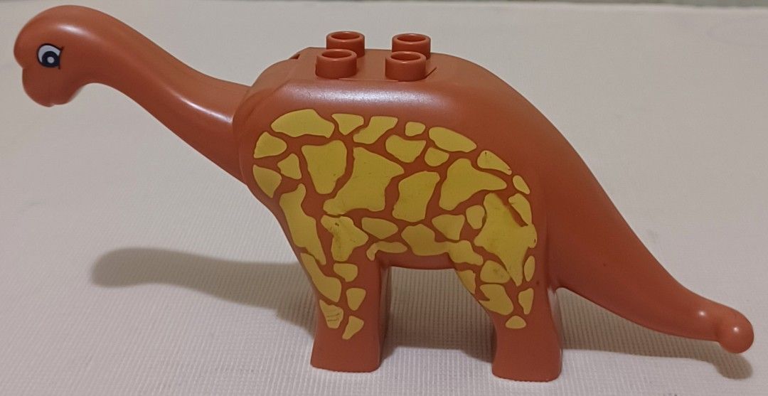🦕 LEGO Duplo Brachiosaurus Dinosaur (Category: Lego & Building Sets) located in Quezon City. Submitted by wjmae (Listing ID 1461070763, Image 2). Description: ✅ Details: - Genuine LEGO Duplo figure — Brachiosaurus long-neck dino ​ - Size: ~5" tall × 5" long ​ - 4 studs on back — attach Duplo bricks & figures easily ​ - Printed pattern, sturdy thick plastic ​ - Condition: Used with light wear/scuffs — no cracks, no missing pieces ​ - Recommended 