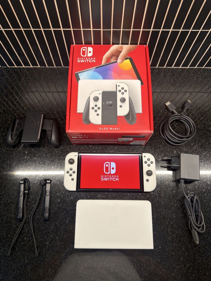 🎮 Nintendo Switch OLED Bundle – PhP12,000.00 (Category: Nintendo) located in Muntinlupa City. Submitted by richdeleon (Listing ID 1461107252, Image 1). Description: Selling my Nintendo Switch OLED, in excellent condition and well taken care of. Fully functional with no known issues. Inclusions: • Nintendo Switch OLED console • Original box and packaging • Original accessories • Skull & Co. Rhino Glass Series Screen Protector – one (1) installed 
