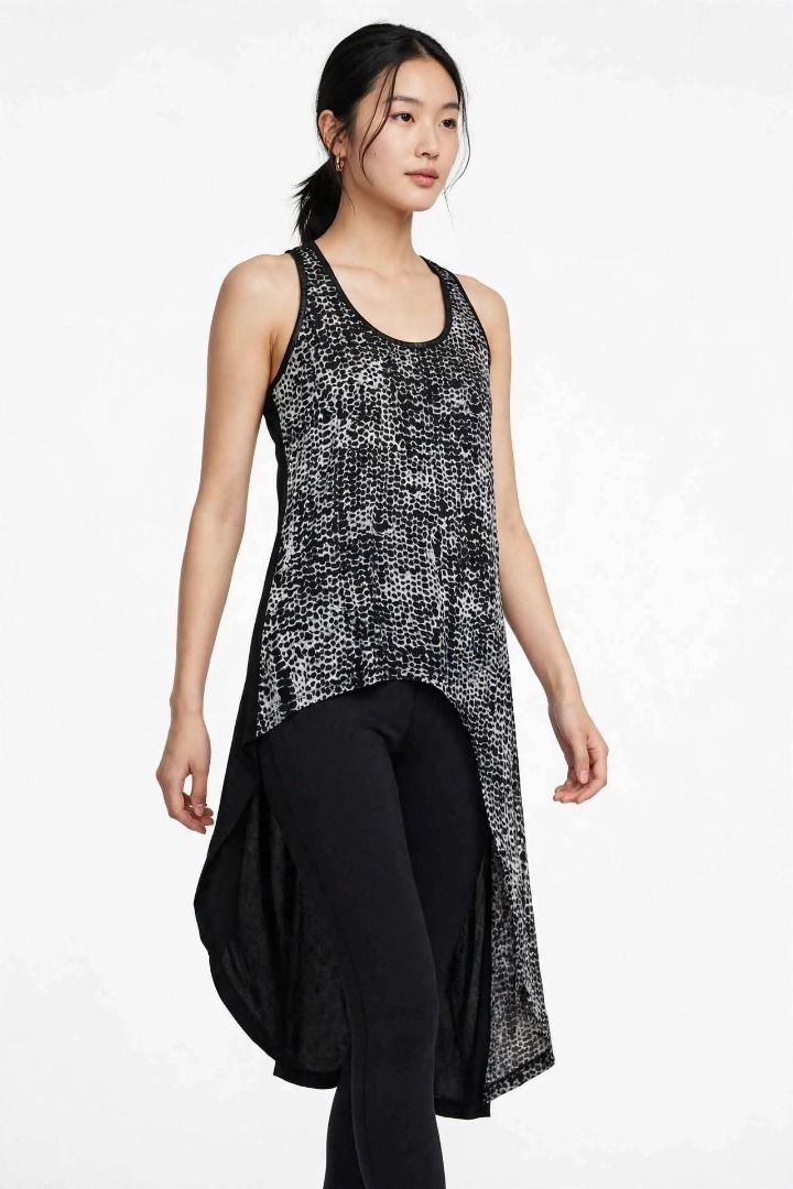 Abstract Asymmetrical Tank Top#72 (Category: Sleeveless) located in Caloocan City. Submitted by outfitloop (Listing ID 1461114954, Image 1). Description: - black and white abstract print tank top - Asymmetrical hemline with a flowy, layered look - Versatile for layering or wearing alone IMPORTANT: • 1st photo is an AI styling/model preview for reference on how the item may look when worn. • Please refer to the actual photos for the item’s true ap