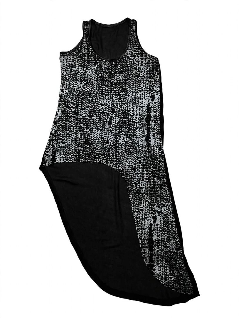 Abstract Asymmetrical Tank Top#72 (Category: Sleeveless) located in Caloocan City. Submitted by outfitloop (Listing ID 1461114954, Image 2). Description: - black and white abstract print tank top - Asymmetrical hemline with a flowy, layered look - Versatile for layering or wearing alone IMPORTANT: • 1st photo is an AI styling/model preview for reference on how the item may look when worn. • Please refer to the actual photos for the item’s true ap